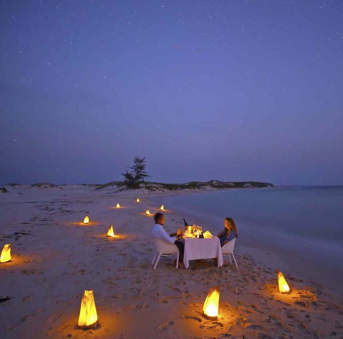 Azura Benguerra dining on beach 3